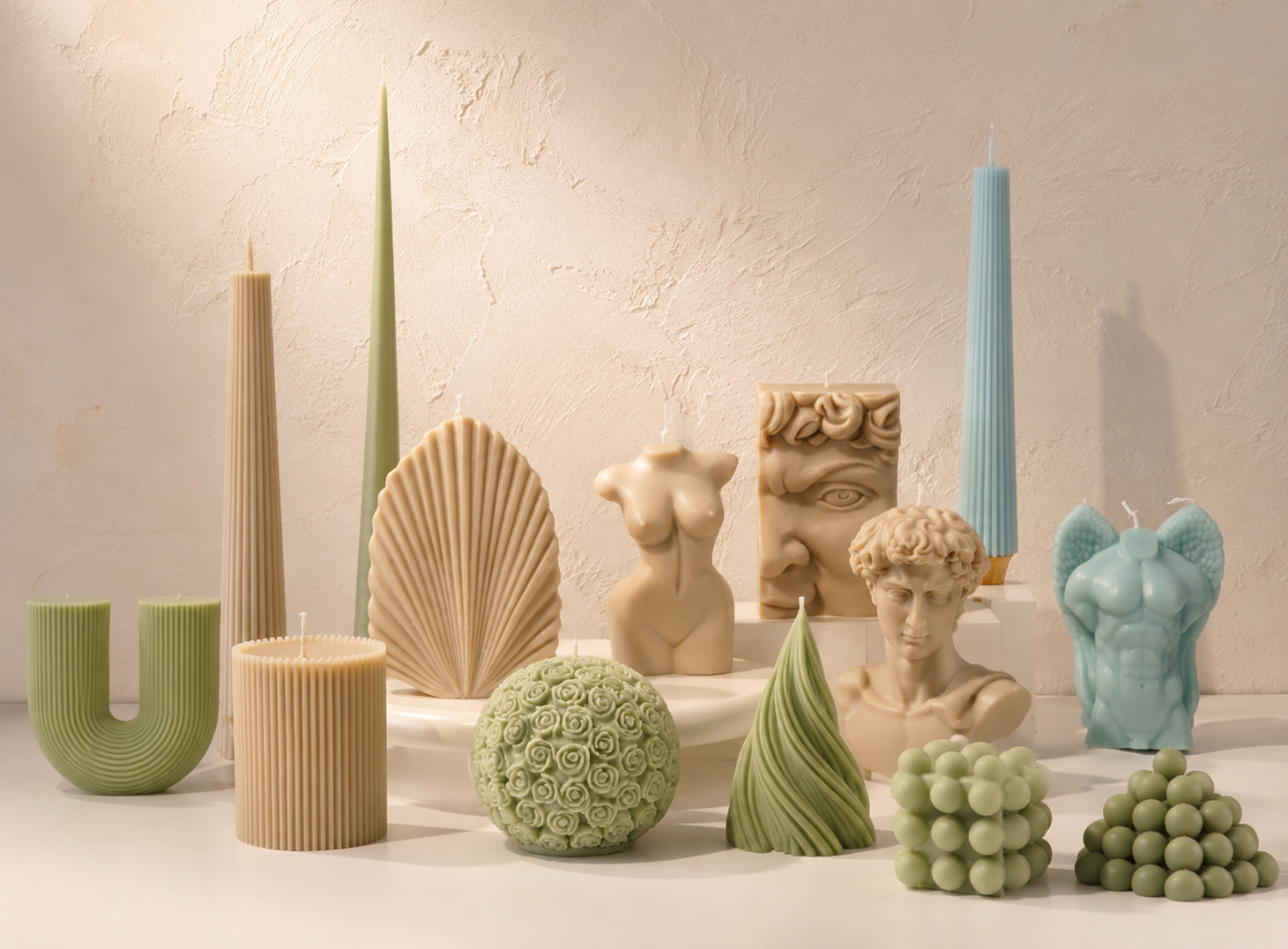Sculptural candle series -- custom geometric candle forms in warm ivory studio light