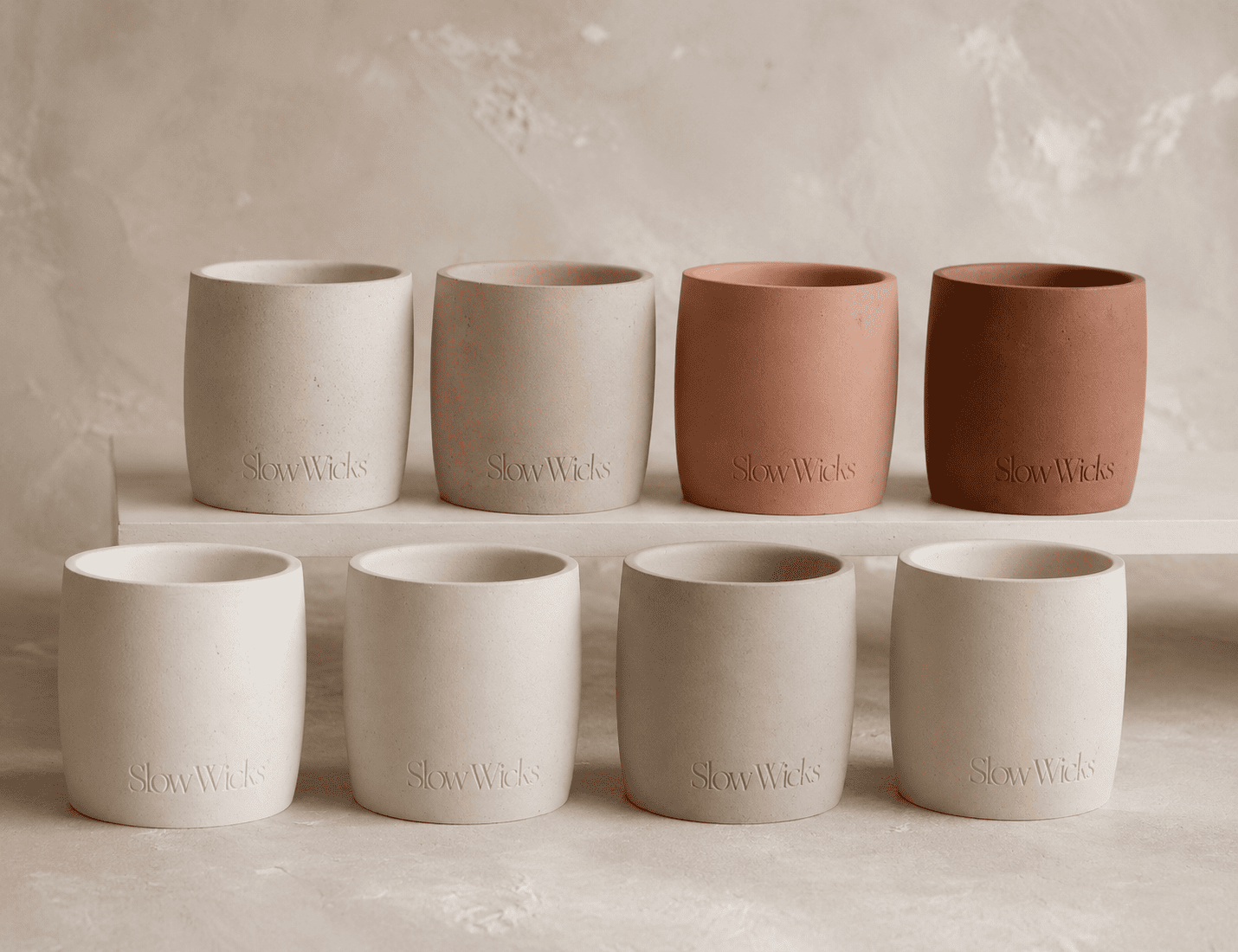 ZLCandle studio -- prototypes, molds, wax samples, and plaster material trials on a work surface